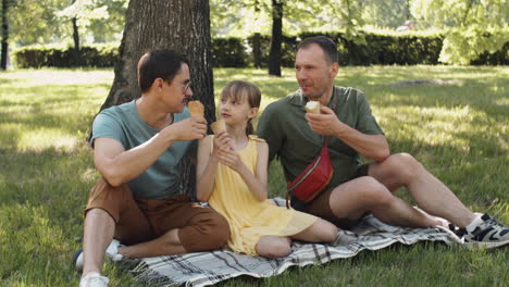Gay-Couple-with-Kid-Outdoors